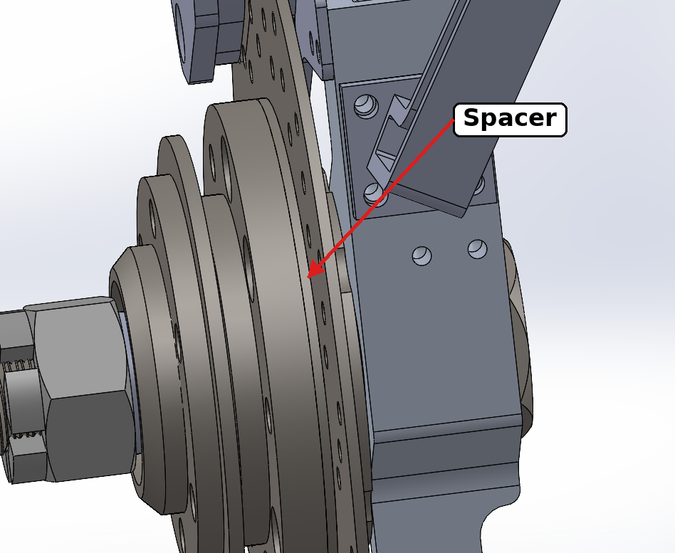 Front suspension assembly showing the spacer between the hub and rotor